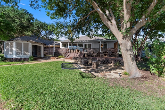 431 Jib Dr, Gun Barrel City, TX 75156 - rear view of house with a sunroom and a yard
