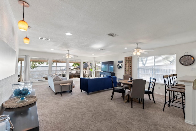 431 Jib Dr, Gun Barrel City, TX 75156 - carpeted living area featuring ceiling fan, healthy amount of natural light, a textured ceiling, and recessed lighting