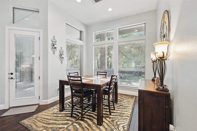 1447 Cimarron Trl, Hurst, TX 76053 - dining space featuring plenty of natural light, baseboards, wood finished floors, and recessed lighting