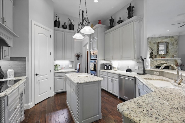 1447 Cimarron Trl, Hurst, TX 76053 - kitchen with a sink, stainless steel appliances, decorative backsplash, light stone countertops, and decorative light fixtures