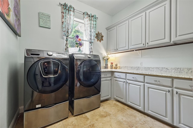 1447 Cimarron Trl, Hurst, TX 76053 - washroom with cabinet space and washing machine and clothes dryer