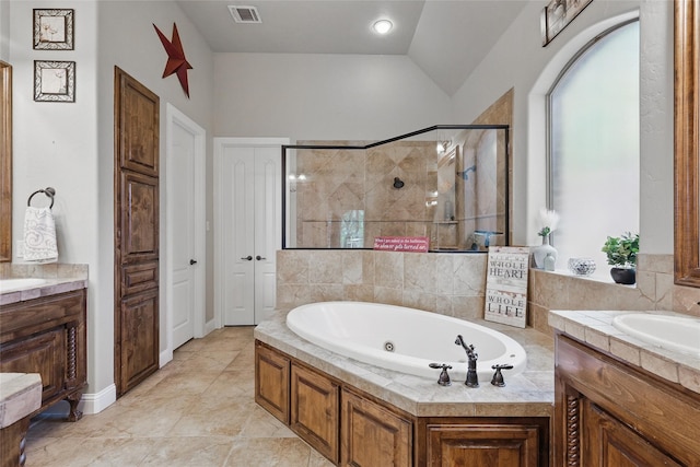 1447 Cimarron Trl, Hurst, TX 76053 - bathroom with a shower stall, a jetted tub, vanity, and vaulted ceiling