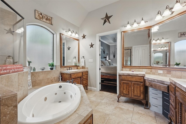 1447 Cimarron Trl, Hurst, TX 76053 - ensuite bathroom with a jetted tub, lofted ceiling, vanity, and a shower