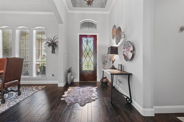 1447 Cimarron Trl, Hurst, TX 76053 - entrance foyer featuring arched walkways, wood-type flooring, baseboards, and ornamental molding