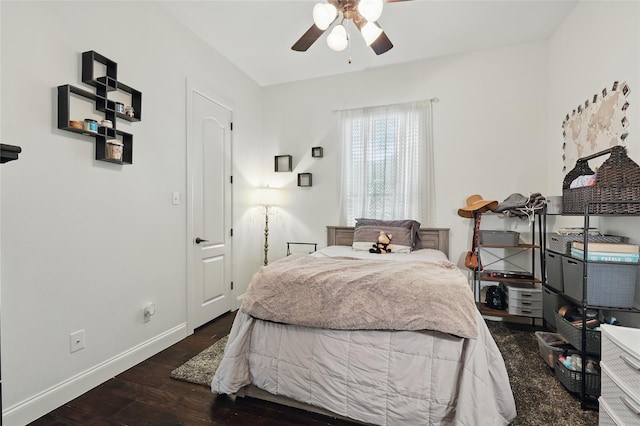 1447 Cimarron Trl, Hurst, TX 76053 - bedroom with wood finished floors, baseboards, and a ceiling fan