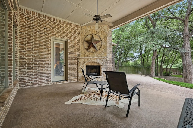 1447 Cimarron Trl, Hurst, TX 76053 - view of patio with an outdoor stone fireplace and ceiling fan