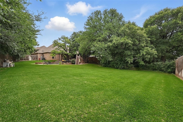 1447 Cimarron Trl, Hurst, TX 76053 - view of yard featuring stairway