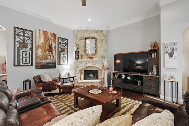 1447 Cimarron Trl, Hurst, TX 76053 - living room with arched walkways, ornamental molding, a fireplace, wood finished floors, and a ceiling fan