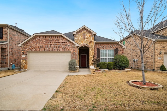 2341 Leeward Pl, Little Elm, TX 75068 - view of front of house with a garage, driveway, brick siding, a front yard, and a shingled roof
