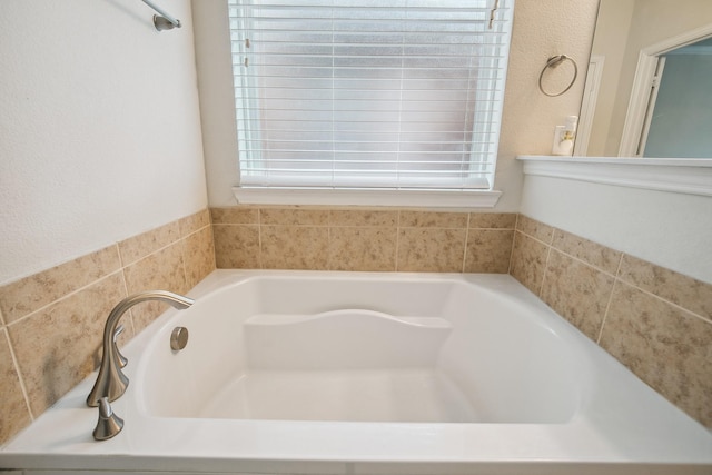2341 Leeward Pl, Little Elm, TX 75068 - bathroom with a bath and plenty of natural light