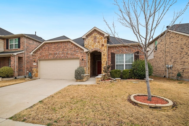 2341 Leeward Pl, Little Elm, TX 75068 - view of front of home with brick siding, a garage, driveway, a front yard, and a shingled roof