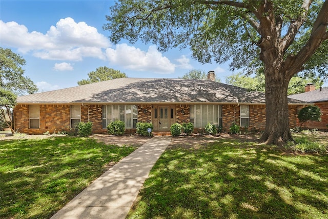 2607 Keystone Dr, Arlington, TX 76006 - ranch-style house with a chimney, a front yard, and brick siding