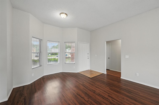 1412 Mockingbird Ln, Desoto, TX 75115 - spare room with dark wood finished floors and baseboards