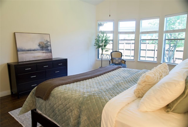 4561 Firewheel Dr, Plano, TX 75024 - bedroom with multiple windows, dark wood-type flooring, and baseboards