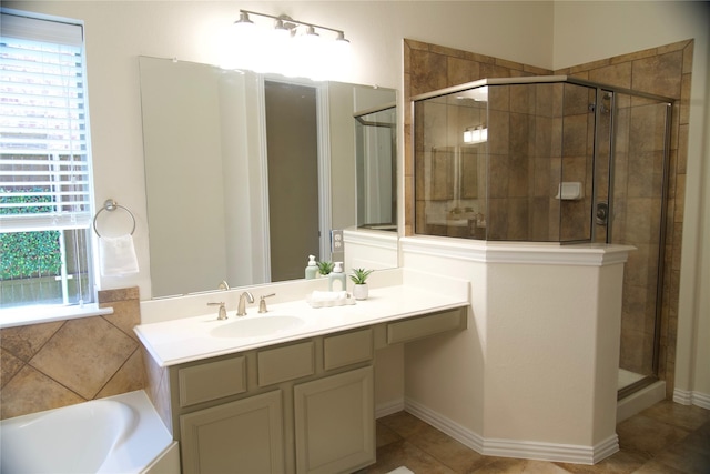 4561 Firewheel Dr, Plano, TX 75024 - bathroom with a stall shower, vanity, plenty of natural light, and a bath