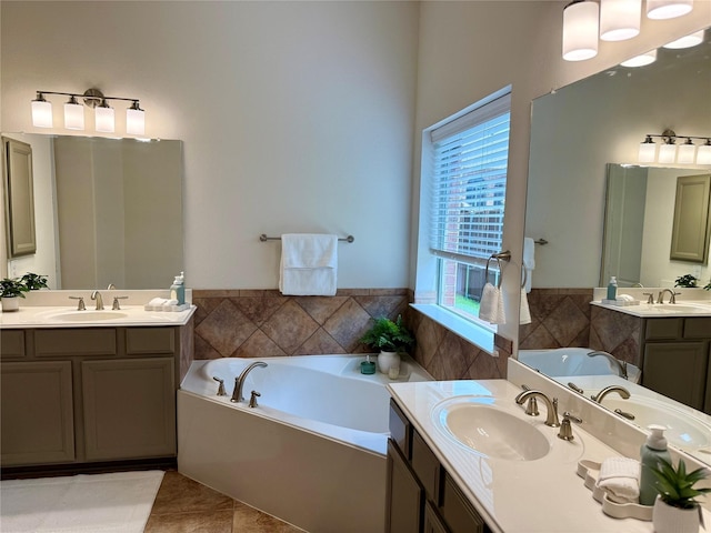 4561 Firewheel Dr, Plano, TX 75024 - full bathroom with two vanities, a garden tub, tile patterned flooring, and wainscoting