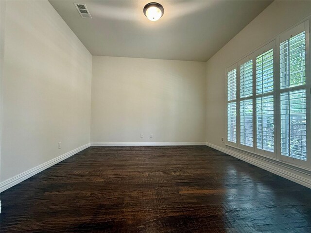 4561 Firewheel Dr, Plano, TX 75024 - empty room featuring baseboards and dark wood-style floors