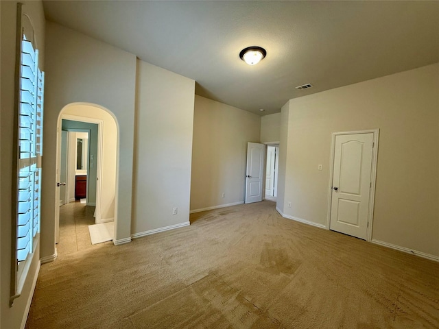 4561 Firewheel Dr, Plano, TX 75024 - carpeted spare room featuring arched walkways and baseboards