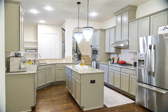 4561 Firewheel Dr, Plano, TX 75024 - kitchen with stainless steel appliances, a sink, under cabinet range hood, a chandelier, and dark wood-type flooring