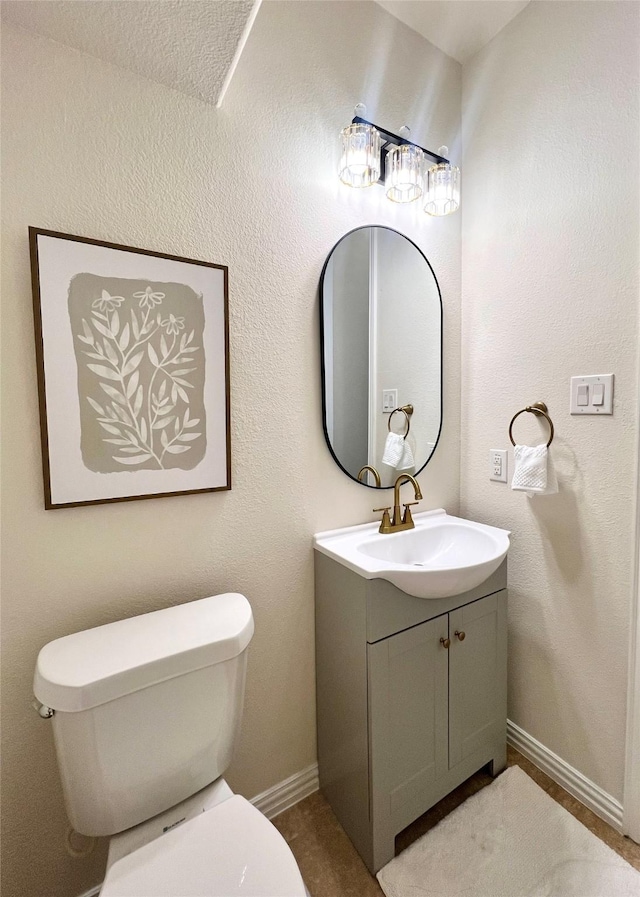 4561 Firewheel Dr, Plano, TX 75024 - bathroom with toilet, vanity, and baseboards