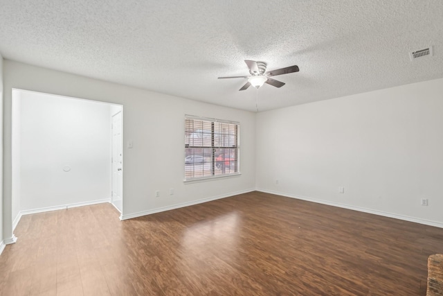 1713 Carrington, Glenn Heights, TX 75154 - unfurnished room with ceiling fan, wood finished floors, and a textured ceiling