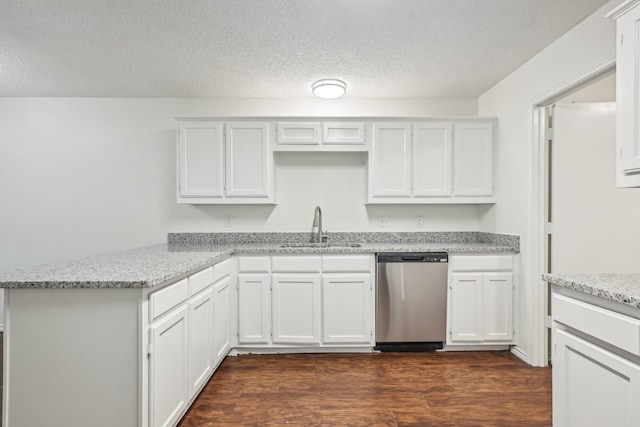 1713 Carrington, Glenn Heights, TX 75154 - kitchen featuring stainless steel dishwasher, a peninsula, white cabinets, dark wood finished floors, and a textured ceiling