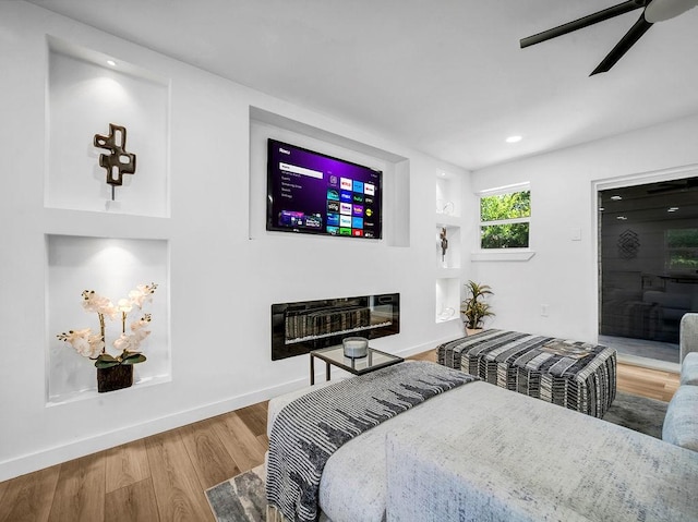 2371 Chart Dr, Dallas, TX 75228 - bedroom featuring wood finished floors, baseboards, recessed lighting, ceiling fan, and a glass covered fireplace