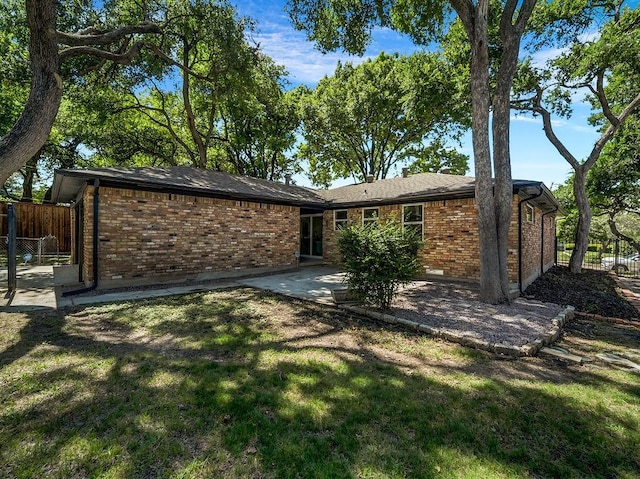 2371 Chart Dr, Dallas, TX 75228 - back of house featuring brick siding and a patio area