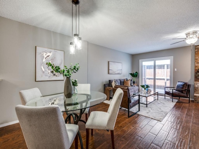 46 Morrow Dr, Bedford, TX 76021 - dining space featuring a textured ceiling, dark wood finished floors, ceiling fan, and baseboards