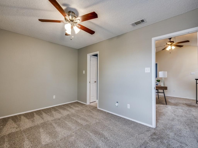 46 Morrow Dr, Bedford, TX 76021 - unfurnished room featuring ceiling fan, carpet flooring, a textured ceiling, and baseboards