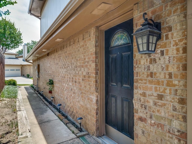 46 Morrow Dr, Bedford, TX 76021 - view of exterior entry featuring brick siding