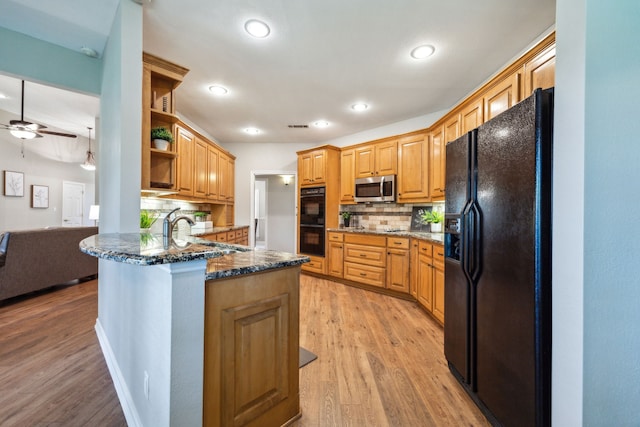 7968 Fm 121, Van Alstyne, TX 75495 - kitchen featuring black appliances, a peninsula, open shelves, light wood finished floors, and recessed lighting