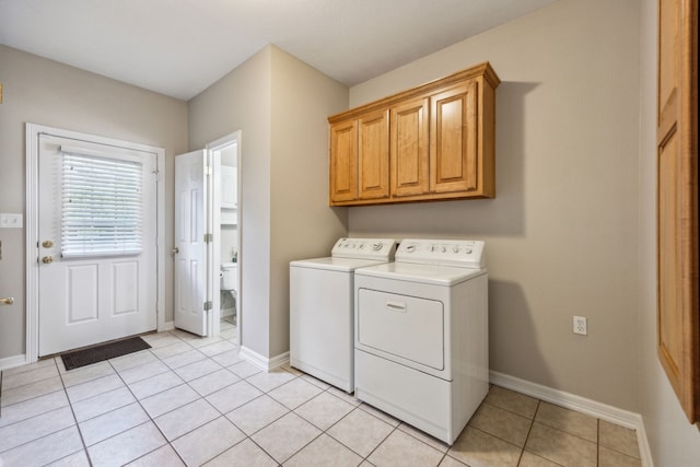 7968 Fm 121, Van Alstyne, TX 75495 - washroom with washer and clothes dryer, light tile patterned floors, baseboards, and cabinet space