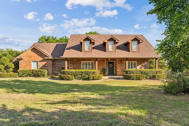 7968 Fm 121, Van Alstyne, TX 75495 - cape cod-style house with brick siding, a front lawn, and a shingled roof