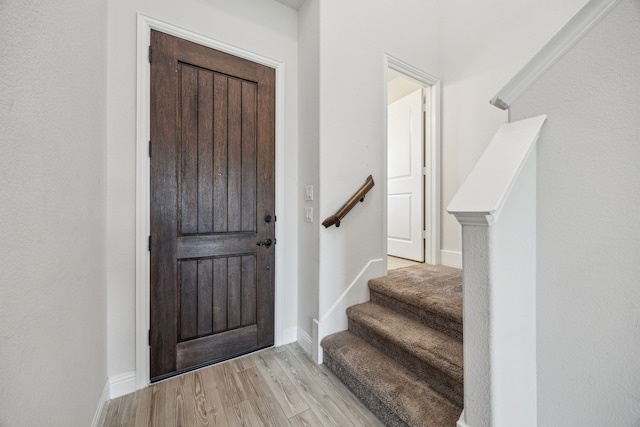 808 N Brenham Ave, Celina, TX 75009 - foyer with light wood finished floors, stairs, and baseboards