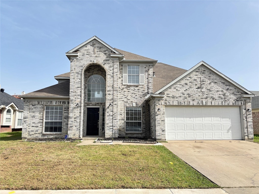 707 Claridge Dr, Arlington, TX 76018 - traditional-style house with an attached garage, brick siding, and a front lawn