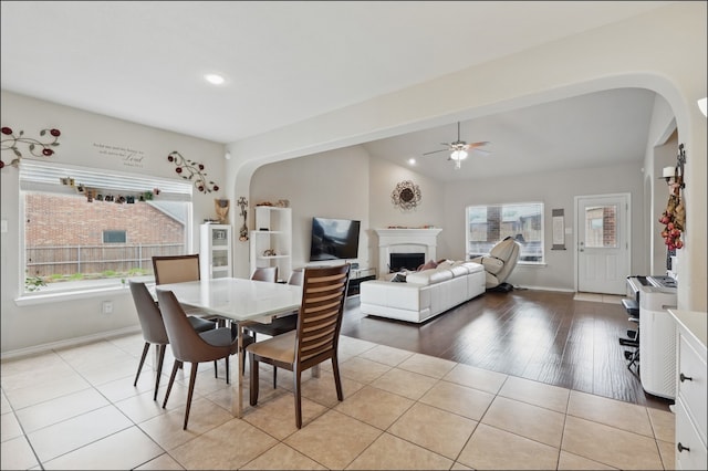 31 Oakridge Ln, Edgecliff Village, TX 76134 - dining space with arched walkways, ceiling fan, a fireplace, baseboards, and recessed lighting