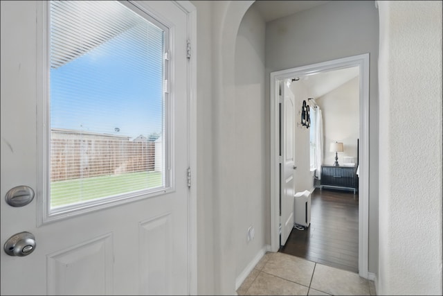 31 Oakridge Ln, Edgecliff Village, TX 76134 - entryway featuring light tile patterned flooring, baseboards, and radiator heating unit