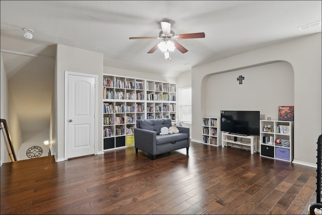 31 Oakridge Ln, Edgecliff Village, TX 76134 - sitting room with a ceiling fan, wood finished floors, arched walkways, built in shelves, and baseboards