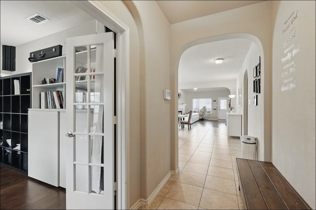 31 Oakridge Ln, Edgecliff Village, TX 76134 - hall featuring arched walkways, tile patterned flooring, and baseboards