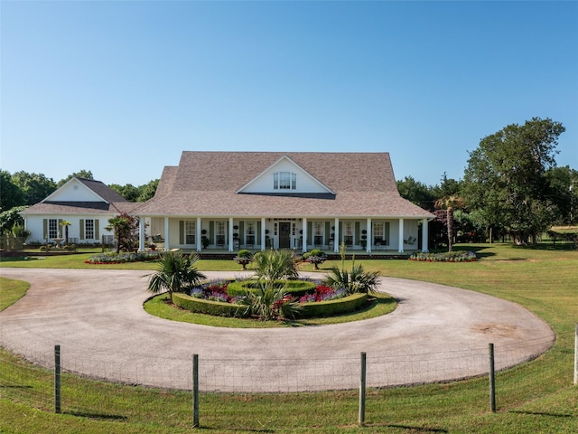 12090 W Fm 346, Bullard, TX 75757 - farmhouse-style home with curved driveway, a porch, and a front yard