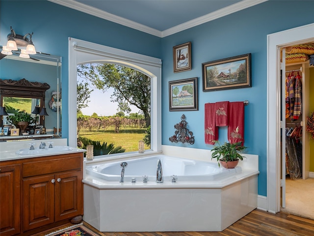 12090 W Fm 346, Bullard, TX 75757 - bathroom featuring vanity, a garden tub, a spacious closet, wood finished floors, and crown molding
