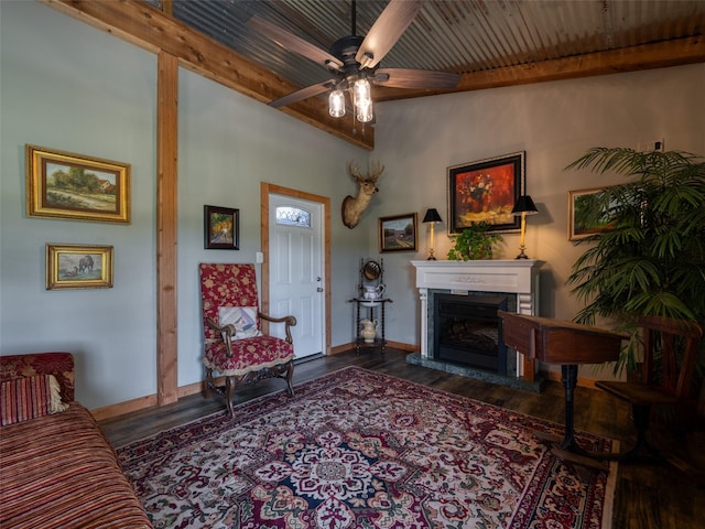 12090 W Fm 346, Bullard, TX 75757 - living room featuring a ceiling fan, wood finished floors, a fireplace with raised hearth, baseboards, and wood ceiling with exposed beams