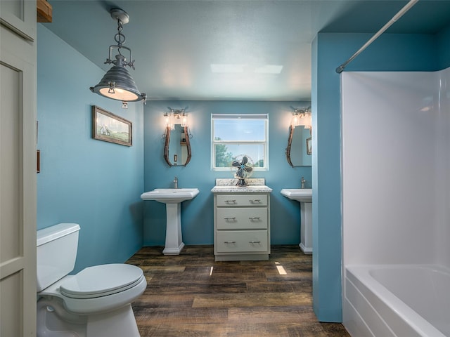12090 W Fm 346, Bullard, TX 75757 - bathroom with wood finished floors, toilet, bathtub / shower combination, and a sink