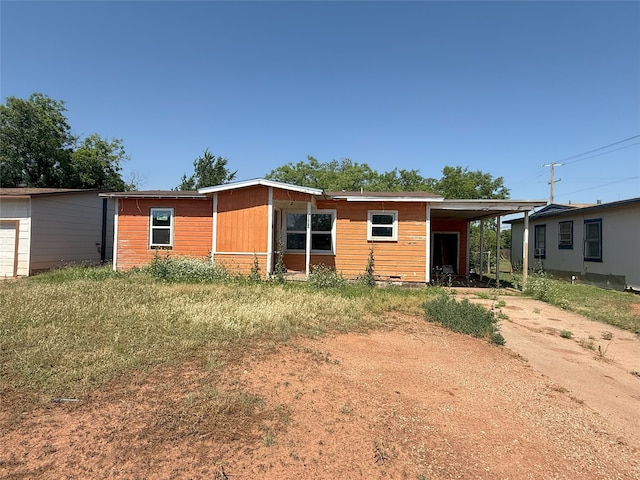 2458 N Mockingbird Ln, Abilene, TX 79603 - view of front of house featuring driveway and a carport