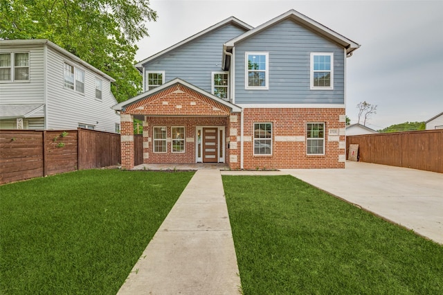 2723 Bentley Ave, Dallas, TX 75211 - view of front facade featuring brick siding, a patio area, and driveway