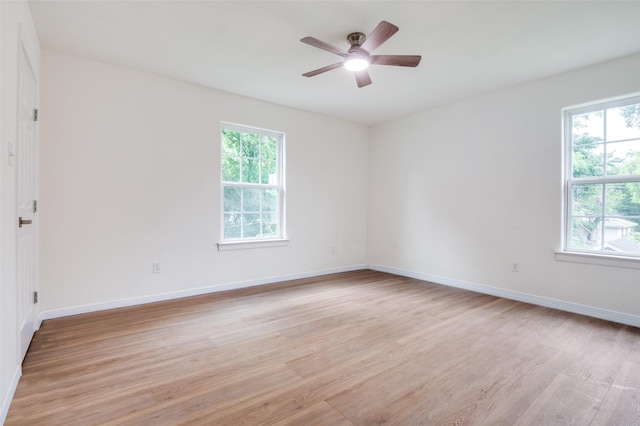 2723 Bentley Ave, Dallas, TX 75211 - unfurnished room featuring light wood-style floors, ceiling fan, and baseboards