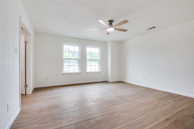 2723 Bentley Ave, Dallas, TX 75211 - unfurnished room with a ceiling fan, light wood-type flooring, and baseboards