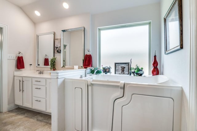 324 Jefferson Ln, Fate, TX 75189 - bathroom featuring vanity, a tub to relax in, and recessed lighting