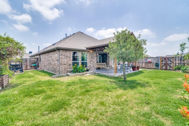 324 Jefferson Ln, Fate, TX 75189 - back of house with a patio area, brick siding, a gate, and roof with shingles